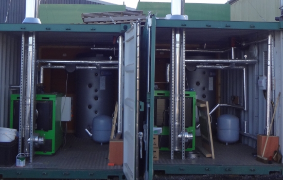 Two green boilers in containers Two green boilers in containers