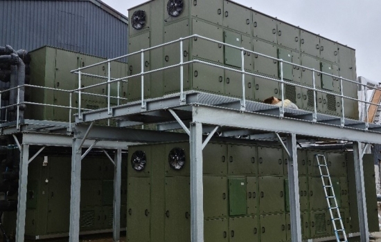 A large heat pump outside a farm building A large heat pump outside a farm building