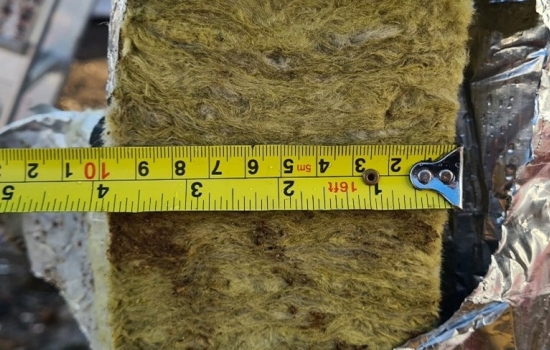 Tape measure measuring the thickness of insulation Tape measure measuring the thickness of insulation