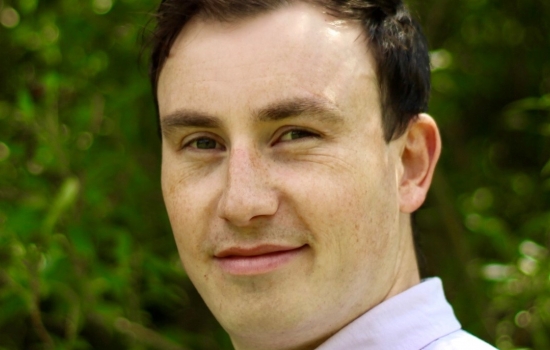Oli Coe with a green background Oli Coe with a green background