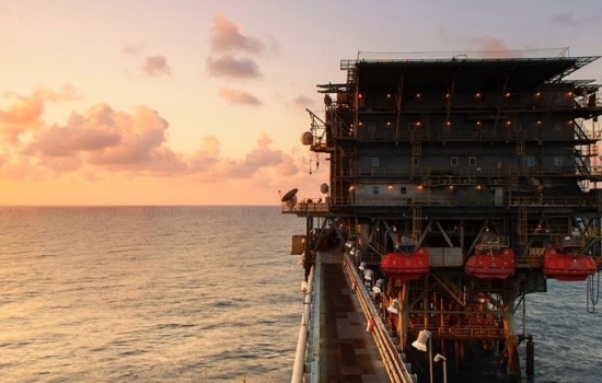 oil rig in the ocean with a sunset oil rig in the ocean with a sunset
