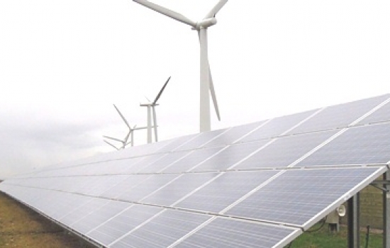 Solar panels with wind turbines behind Solar panels with wind turbines behind