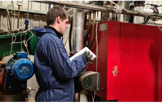 Engineer auditing pipework and machinery Engineer auditing pipework and machinery