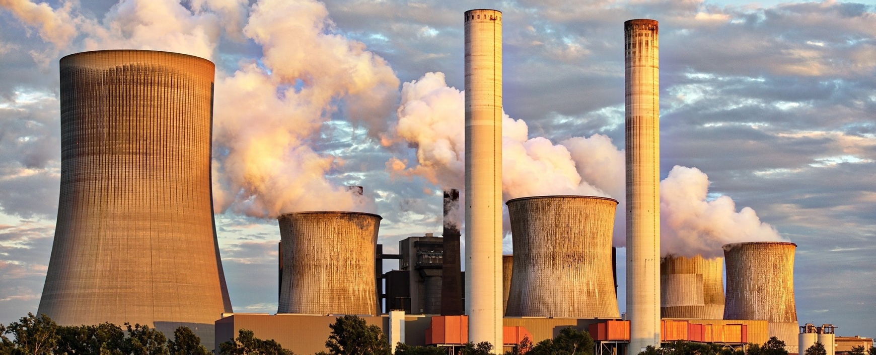 power station with smoke coming out of the chimneys