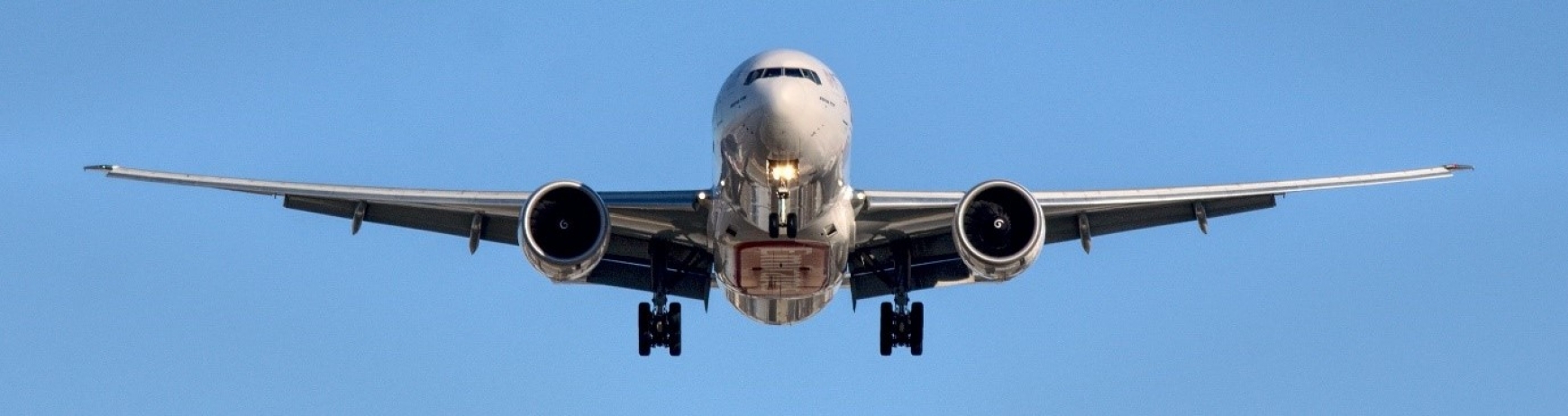 plane flying in blue sky