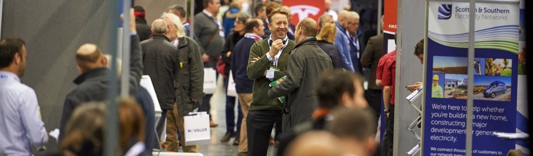 People standing chatting at an expo