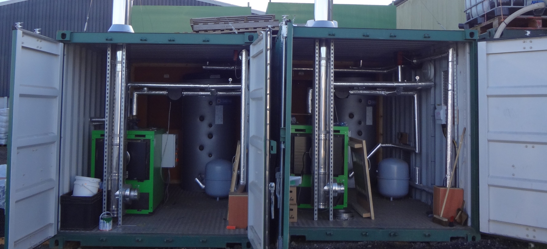 Two green boilers in containers 