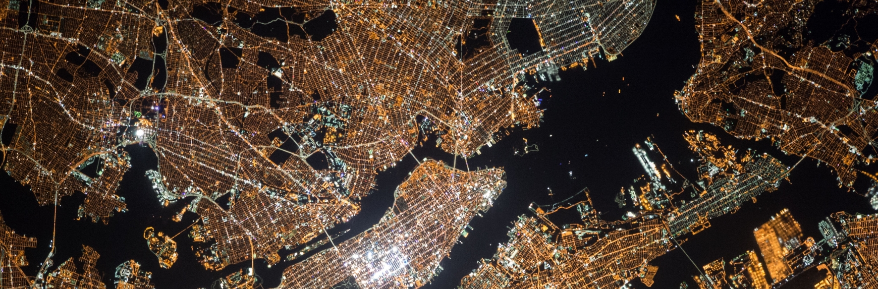 An arial view of a city lights at night