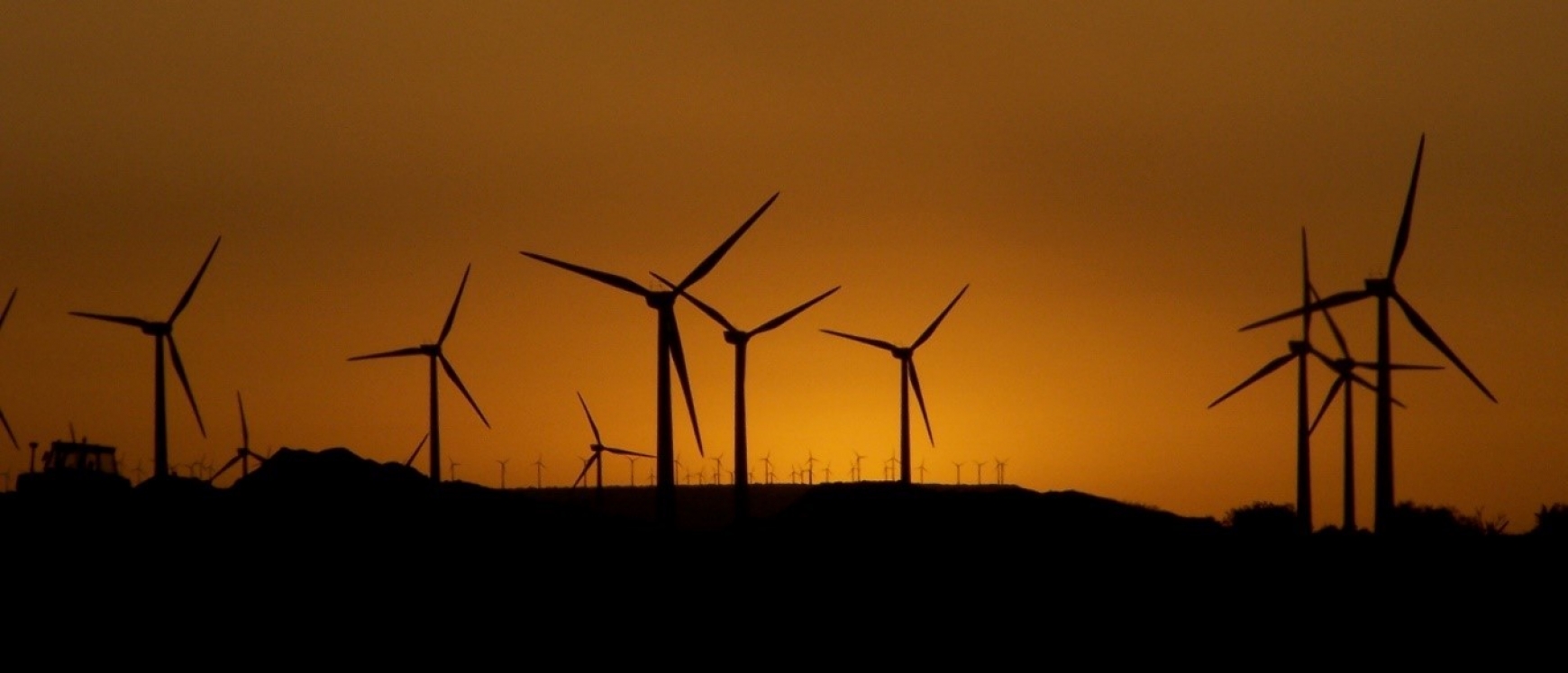Silhouette of wind turbines in the sunset 