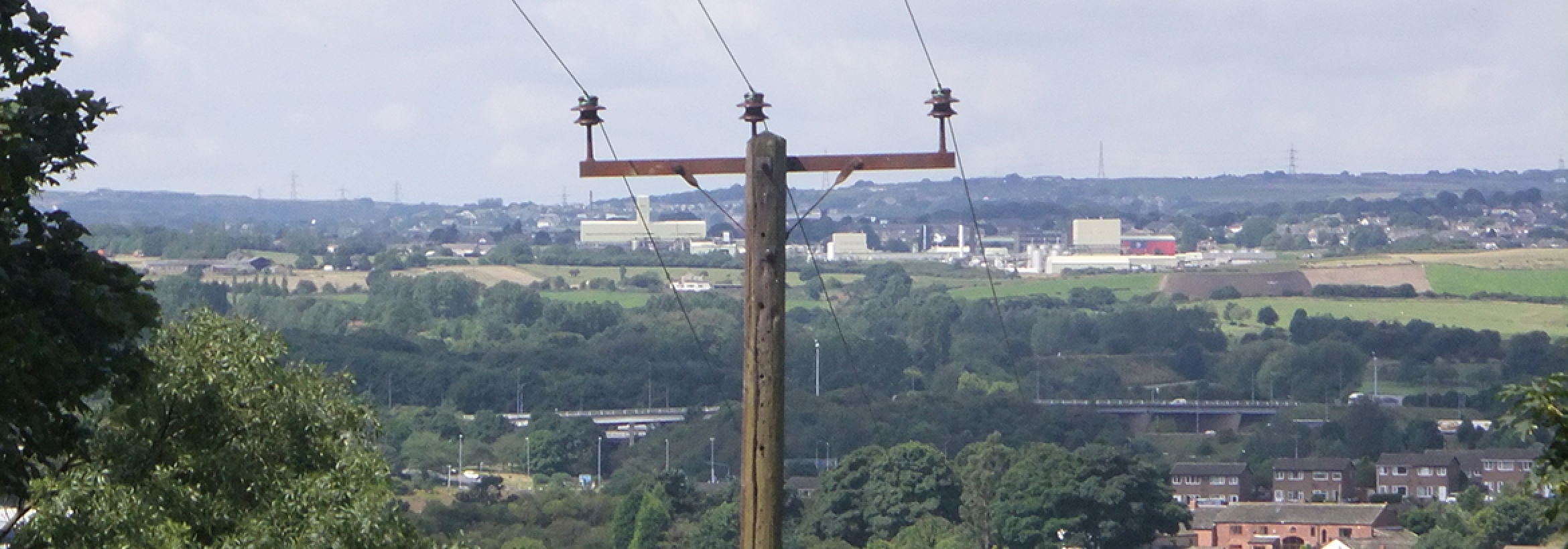 Electricity cables on pillars distributing energy representing NFU Energy's wayleaves and easements support service